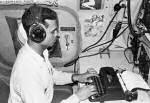 Radioman, Navarro, types up message report. in one of VW-1's WV-2 aircraft